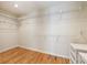 Walk in closet with hardwood floors and white wire racks at 111 Paces Run, Atlanta, GA 30339