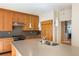 Modern kitchen boasts stainless appliances, island, wooden cabinets and a built-in microwave at 111 Paces Run, Atlanta, GA 30339