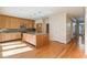 Open kitchen boasts modern cabinets, granite countertops, stainless steel appliances, and hardwood floors at 111 Paces Run, Atlanta, GA 30339