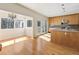 Open floor plan featuring hardwood floors, a kitchen island, and plenty of sunlight from the dining area at 111 Paces Run, Atlanta, GA 30339