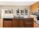Gourmet kitchen with stainless steel appliances, granite countertops, and sliding doors to the rear deck at 111 Paces Run, Atlanta, GA 30339