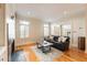 Elegant living room with hardwood floors, fireplace, natural light, and plantation shutters at 111 Paces Run, Atlanta, GA 30339