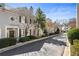 Charming townhomes with manicured landscaping and tree-lined street in a desirable neighborhood at 111 Paces Run, Atlanta, GA 30339