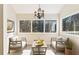 Bright sunroom with scenic views, comfortable seating, chandelier lighting and hardwood floors at 111 Paces Run, Atlanta, GA 30339