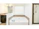 Bathroom featuring a soaking tub, separate shower, and large vanity at 3129 Arbor Oaks Dr, Snellville, GA 30039