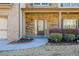 Inviting front porch with stone accents, manicured landscaping, and a charming entranceway at 3129 Arbor Oaks Dr, Snellville, GA 30039