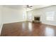 Spacious living room featuring a fireplace, hardwood floors, and neutral wall color at 3129 Arbor Oaks Dr, Snellville, GA 30039