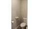 Toilet room with gray walls, wood-look flooring, and a white toilet at 83 Nyishol Way, Dallas, GA 30157