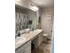 Bright bathroom with double sinks, granite countertop and a large mirror at 83 Nyishol Way, Dallas, GA 30157