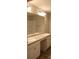 Bathroom featuring dual sinks, granite countertops, and a large mirror at 83 Nyishol Way, Dallas, GA 30157