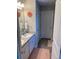 Bathroom features a double sink vanity with granite countertop and decorative wall art at 83 Nyishol Way, Dallas, GA 30157