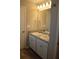 Bathroom featuring double sinks, granite countertops and wood-look flooring at 83 Nyishol Way, Dallas, GA 30157