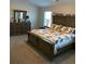 Spacious bedroom featuring a large bed and dresser, creating a cozy and inviting atmosphere at 83 Nyishol Way, Dallas, GA 30157