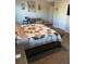 Bright bedroom features a full-sized bed, a comfortable couch and neutral-colored walls at 83 Nyishol Way, Dallas, GA 30157