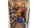 Overstuffed closet with shelves, boxes and hanging clothes, maximizing storage potential at 83 Nyishol Way, Dallas, GA 30157