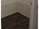 Walk-in closet with dark laminate floor and white wire shelving at 83 Nyishol Way, Dallas, GA 30157