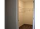 Walk-in closet with white wire shelving and carpeted floor at 83 Nyishol Way, Dallas, GA 30157