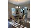 Cozy dining area featuring a modern chandelier and comfortable seating arrangement at 83 Nyishol Way, Dallas, GA 30157