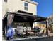 A backyard gazebo with outdoor furniture and dining area, perfect for entertaining at 83 Nyishol Way, Dallas, GA 30157