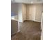 Upstairs hallway featuring neutral carpet and access to two doors at 83 Nyishol Way, Dallas, GA 30157