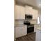 Kitchen featuring stainless steel appliances, white cabinets, and granite countertops at 83 Nyishol Way, Dallas, GA 30157