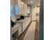 Well-lit kitchen features granite countertops, white cabinets and stainless steel appliances at 83 Nyishol Way, Dallas, GA 30157