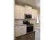Modern kitchen features stainless steel appliances, granite countertops, and white cabinets at 83 Nyishol Way, Dallas, GA 30157