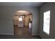 Open kitchen with island, stainless appliances, and elegant chandelier at 83 Nyishol Way, Dallas, GA 30157