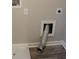 Convenient laundry hookups and shelving in a dedicated utility area for easy maintenance at 83 Nyishol Way, Dallas, GA 30157