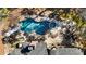 Aerial view of an inground pool, hot tub, and outdoor fireplace at 2250 Blackheath Trce, Alpharetta, GA 30005