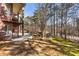 Expansive backyard featuring a spiral staircase and lush landscaping, ideal for outdoor relaxation and entertainment at 2250 Blackheath Trce, Alpharetta, GA 30005