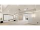 Finished basement featuring a theater screen, projector, speakers, recessed lights, and neutral carpet at 2250 Blackheath Trce, Alpharetta, GA 30005