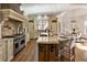 Gourmet kitchen features granite countertops, custom cabinetry, and state-of-the-art appliances at 2250 Blackheath Trce, Alpharetta, GA 30005