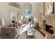 Bright living room with fireplace, high ceilings, and access to outdoor balcony through French doors at 2250 Blackheath Trce, Alpharetta, GA 30005