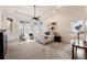 Bright main bedroom with tray ceiling, ceiling fan, carpet and large windows with plantation shutters at 2250 Blackheath Trce, Alpharetta, GA 30005