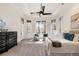 Spacious main bedroom with tray ceiling, multiple windows, and cozy sitting area at 2250 Blackheath Trce, Alpharetta, GA 30005