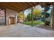 Covered patio with brick fireplace and outdoor access to the backyard which features a play set at 4333 Rickenbacker Ne Way, Atlanta, GA 30342