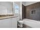 Bathroom boasts modern tub, granite counters, and elegant fixtures, creating a luxurious and inviting space at 4333 Rickenbacker Ne Way, Atlanta, GA 30342