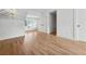 This bedroom features hardwood floors, white molding and baseboards, a chandelier and white plantation shutters at 4333 Rickenbacker Ne Way, Atlanta, GA 30342