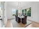 Bright dining room with hardwood floors, natural light, and a view to the backyard at 4333 Rickenbacker Ne Way, Atlanta, GA 30342