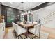 Dining room with dark walls, a wooden table, and modern chairs at 4333 Rickenbacker Ne Way, Atlanta, GA 30342