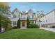 Charming home showcases a manicured lawn, shuttered windows, and a covered front porch at 4333 Rickenbacker Ne Way, Atlanta, GA 30342