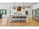 Modern kitchen featuring a large island with seating, stainless steel appliances, and bright white cabinetry at 4333 Rickenbacker Ne Way, Atlanta, GA 30342