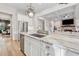Bright kitchen featuring stainless steel appliances, a center island, and an open view into the adjacent living area at 4333 Rickenbacker Ne Way, Atlanta, GA 30342