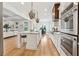 Open-concept kitchen with a center island, stainless steel appliances, and seamless flow into the living area at 4333 Rickenbacker Ne Way, Atlanta, GA 30342