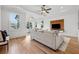 Bright open floor plan of the living room with a tray ceiling and hardwood flooring at 4333 Rickenbacker Ne Way, Atlanta, GA 30342