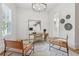 Well-lit office with a desk, leather chairs, and white walls at 4333 Rickenbacker Ne Way, Atlanta, GA 30342