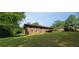 Spacious backyard area with lush greenery and mature trees, perfect for outdoor enjoyment at 4643 Wesley Dr, Austell, GA 30106