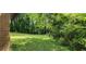 Lush backyard showcasing mature trees and plenty of green space at 4643 Wesley Dr, Austell, GA 30106