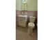 Bathroom with white fixtures and pink tile at 4643 Wesley Dr, Austell, GA 30106